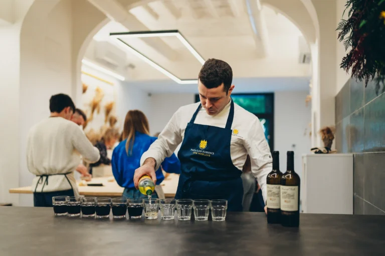 chef while put some wine in a glasses