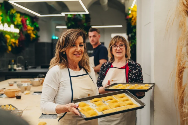 people presenting the ravioli pasta they have made