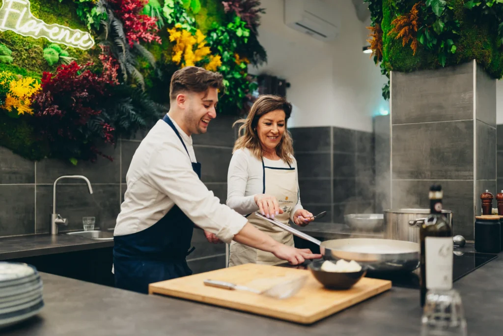 person cooking on the induction while chef is looking