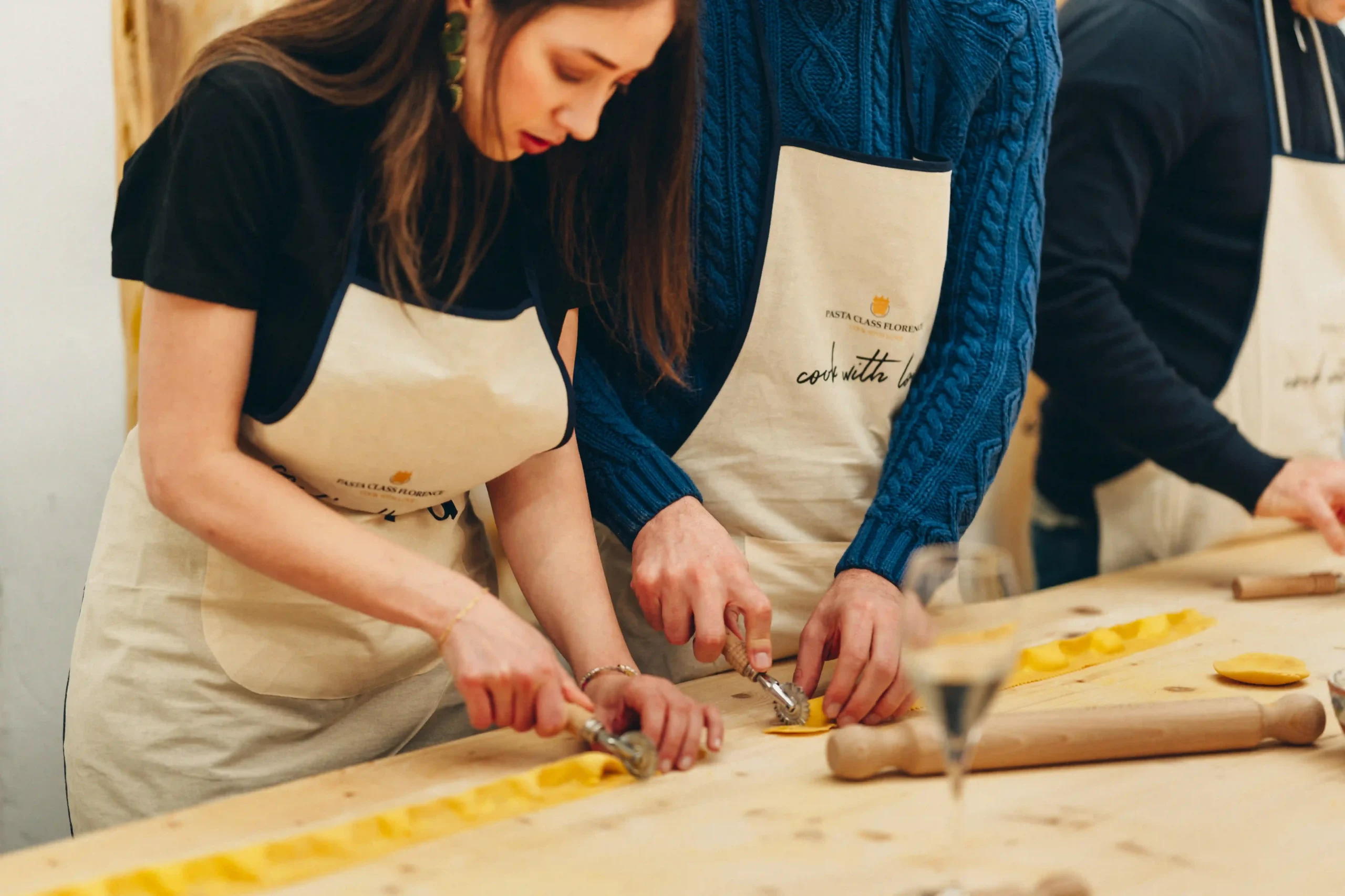 person cutting ravioli pasta