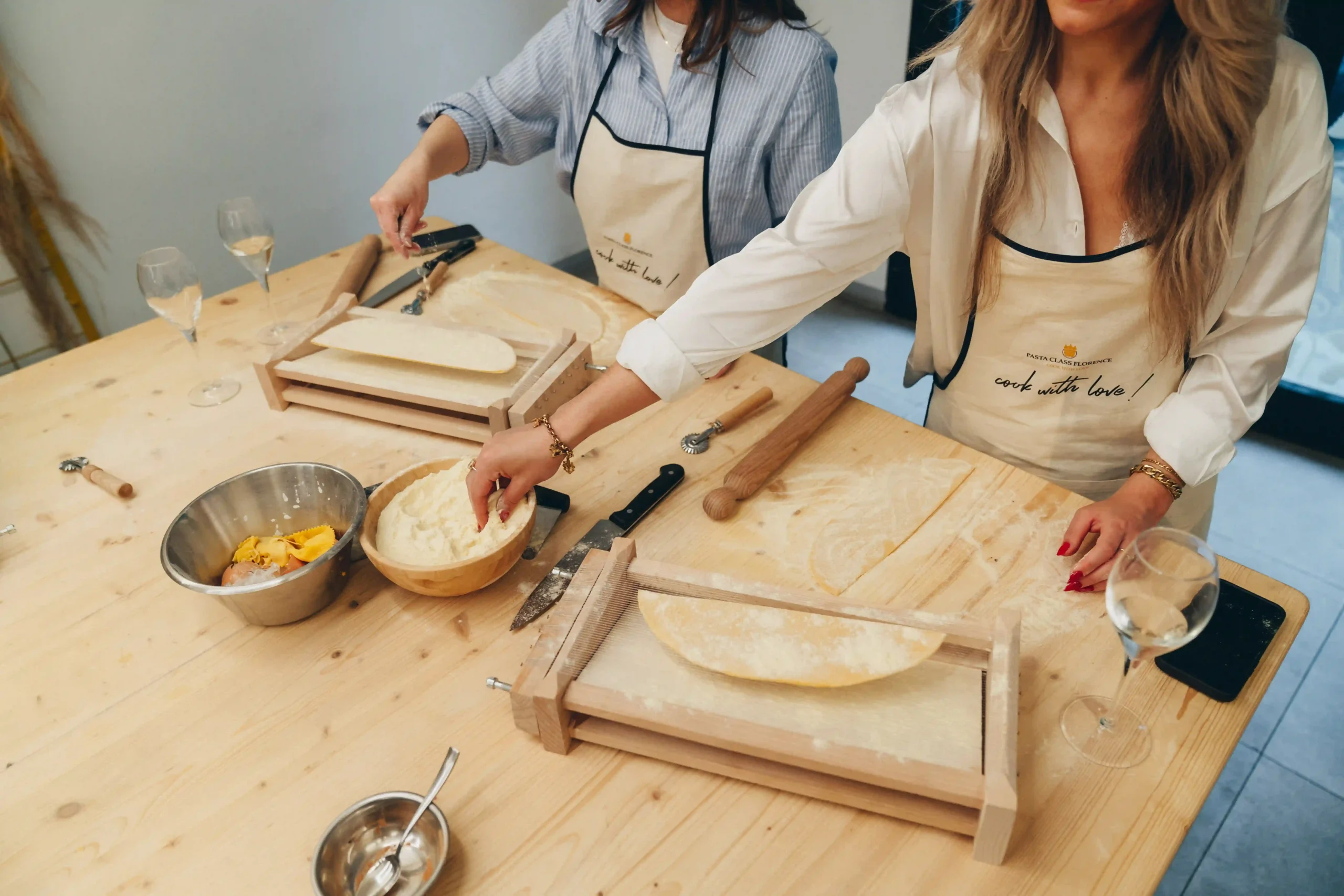 people cutting che pasta dough