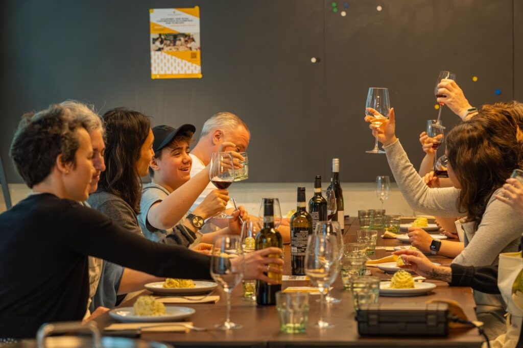 people enjoying their dishes made with the pasta they created themselves