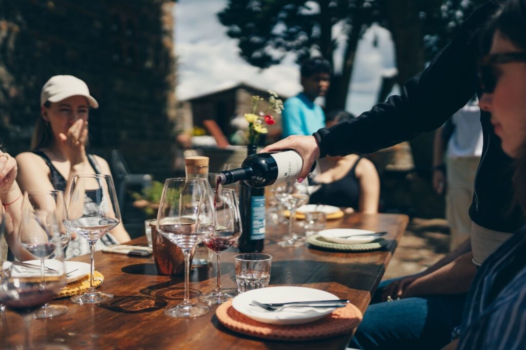 a table full of people drinking wine in chianti hills