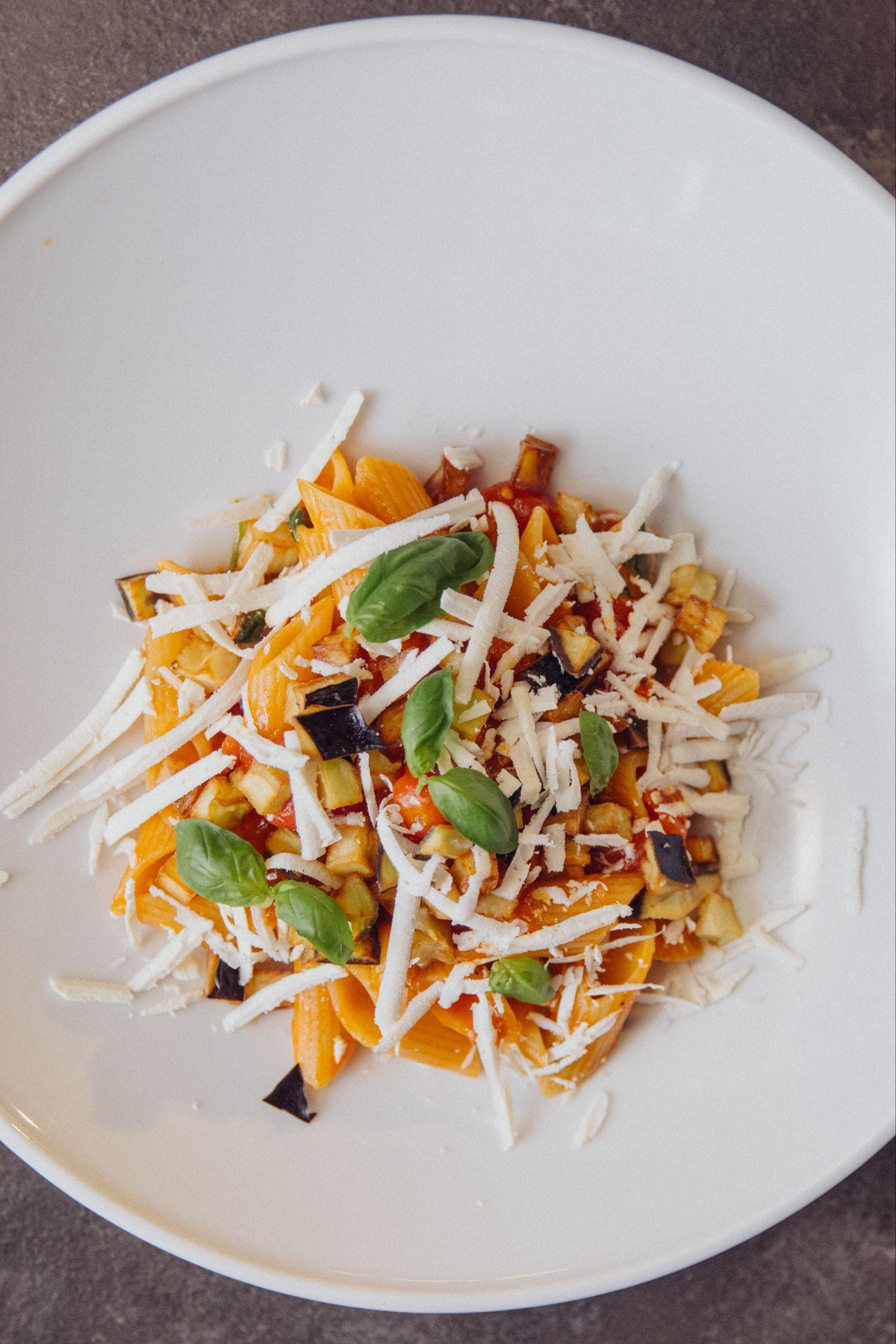 Pasta alla Norma with fried eggplant, tomato sauce and ricotta salata