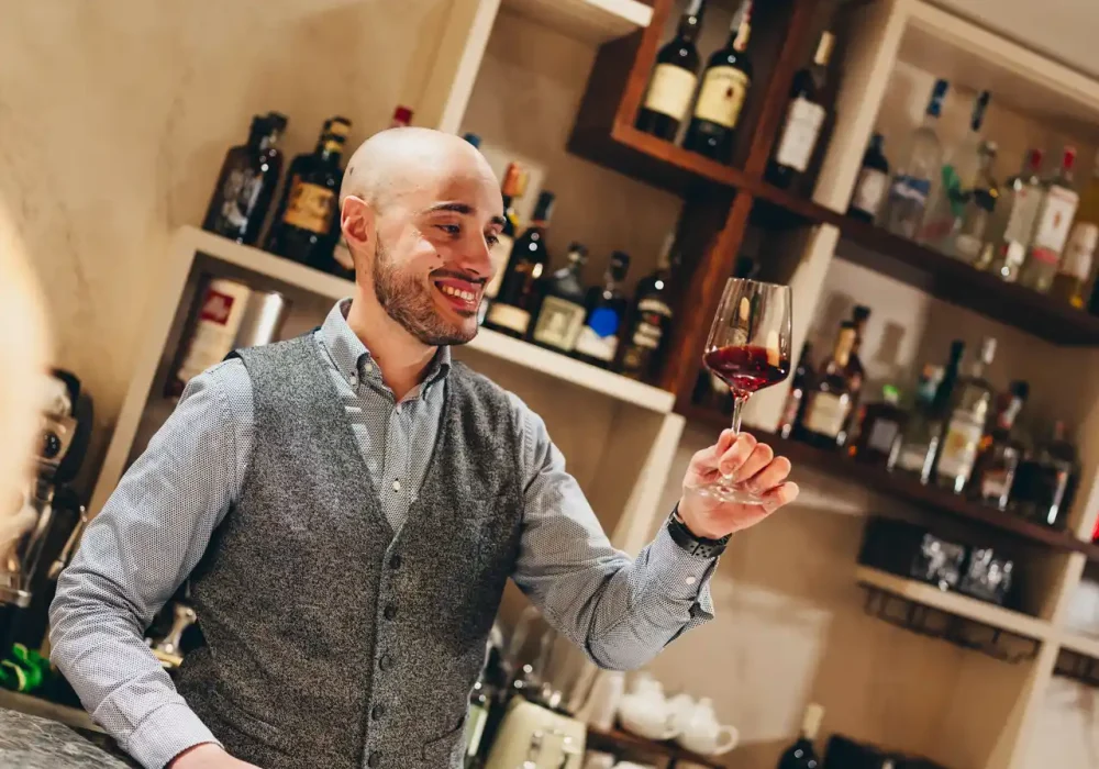 person with a glass of wine