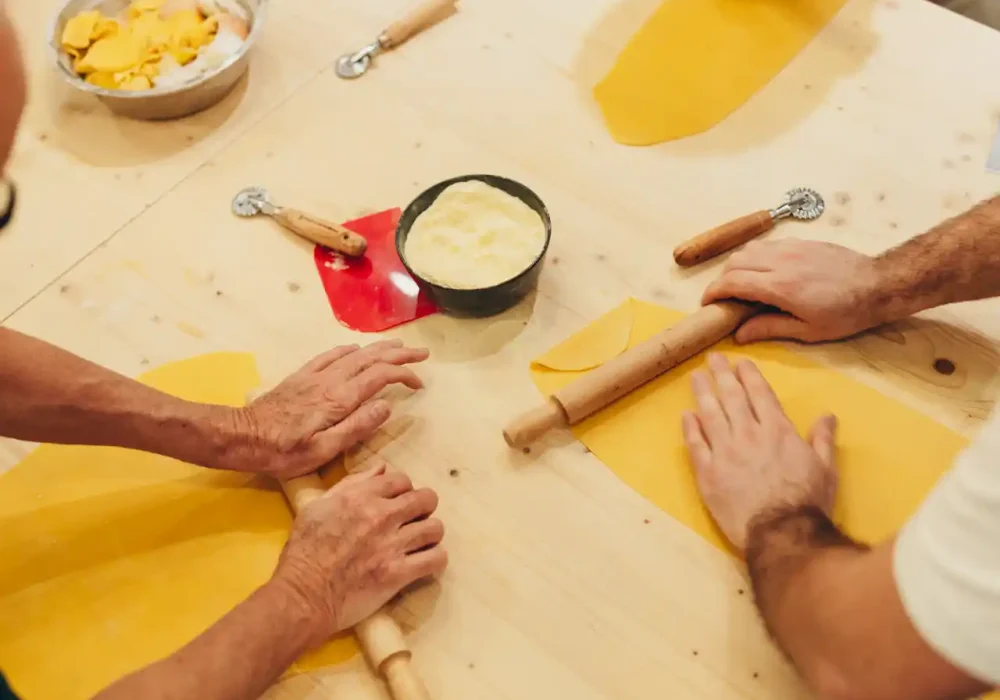 people kneading dough