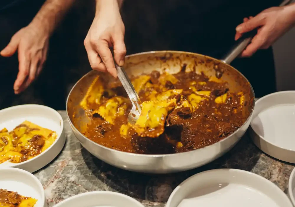 chef serving ravioli pasta