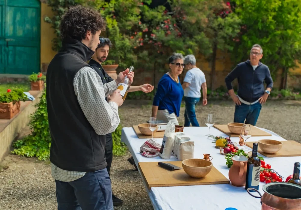 people doing a pasta class with truffle in the middle of chianti